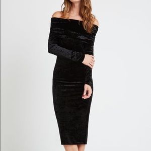 Black velvet off the shoulder midi dress.